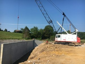 Jones Brothers Contractors, LLC is installing concrete box culverts and drainage structures, and doing ongoing bridge, grade, and utility work on the new Highway 56 south (McMinnville Highway) roadway alignment.