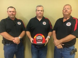 DeKalb Firefighter Blake Cantrell (center) promoted to rank of Lieutenant. Pictured with Lieutenant Dusty Johnson (left) and Captain Jay Cantrell (right)