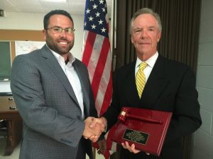 Smithville Mayor Josh Miller presents a plaque to retiring Municipal Judge Hilton Conger for his 29 years of service to the City of Smithville.