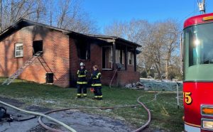 Firefighters on the scene at Shady Lane after a fire at this vacant home