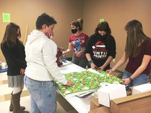 DeKalb West Beta students wrapping gifts during Saturday's Regifting Event
