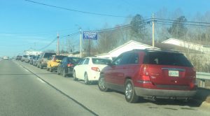 God's Food Pantry was a busy place Friday morning as people waited in a car line on East Broad Street to get a box of food