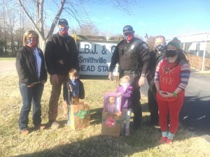 Children at the Smithville Head Start Center were treated to bags of gifts Friday thanks to the Smithville Police Department’s “Cops4Kids” program. Pictured left to right: Police Department Records Clerk Beth Adcock, Chief Mark Collins, Head Start students Easton Coronado and Shawna Buck with their bags of toys, Officers Kendall Parker and Travis Bryant and LBJ & C Smithville Head Start Director Cathy Shehane.