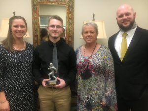 Senior Kicker Jasper Kleparek received the Coach Clay Edwards Memorial Tiger Pride Award presented by members of Edwards’ family, Abram Edwards (pictured far right) and Sarah Rathbone (far left), son and daughter, and their mother Tena Edwards-Jacobs. Kleparek also received the special teams player of the year and the All-Region Most Outstanding Kicker honor. Prior to the 2020 season, Kleparek had never played high school football but he quickly excelled after joining the team in the second game of the year and he never missed an extra point or field goal kick in eleven games.