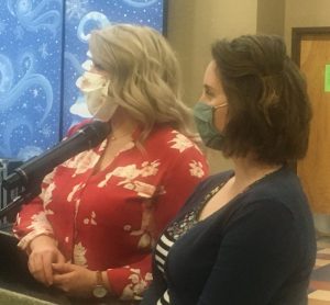 DeKalb Animal Shelter employees Emmaly Bennett (left) and Director Megan Moore (right) take questions during workshop with city aldermen and county commissioners Tuesday night