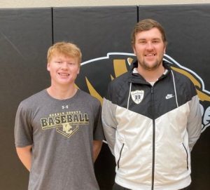 Jordan Young (left) of the DCHS Tiger basketball team earned All-District Honorable Mention. Pictured here with Assistant Tiger Coach Logan Vance