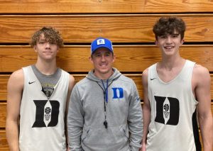 Brayden Antoniak (right) of the DCHS Tiger basketball team made the All-District Defensive Team while Elishah Ramos (left) earned Honorable Mention. Pictured here with Tiger Coach John Sanders