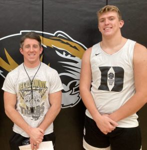 Evans Jones of the DCHS Tiger basketball team has been named to the 2nd Team All-District. Jones is pictured here with Tiger Coach John Sanders