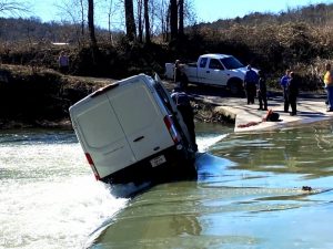 The driver of this 2019 Ford Amazon commercial transport van escaped injury as his vehicle was nearly carried away by swift creek waters Tuesday, February 23 on Odom Page Road (Preston-Vickers Road) at Liberty.