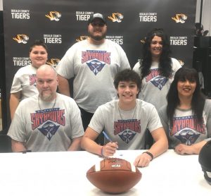 Family members joined DCHS Tiger Football Senior Demond Nokes at DCHS where he signed a letter of intent to play for the UT Martin Skyhawks. Seated left to right (father Toby Nokes), Desmond Nokes, (mom Jamie Greco) Standing: siblings Justis Nokes, Tayvian Nokes, and Jayde Stanley