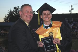 DCHS Principal Randy Jennings presents Citizenship Award to Levi Driver during Class of 2021 graduation Friday night