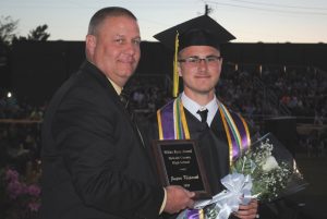 DCHS Principal Randy Jennings presents White Rose Award to Jasper Kleparek during Class of 2021 graduation Friday night