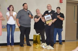 Band Director Tracy Luna receives plaque from band boosters.