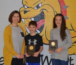 DeKalb West School students Hannah Brown and Kaden Mullinax each received plaques for earning 1,000 Accelerated Reader points this year. Kenadee Prichard (not pictured) also had that distinction. Shown here with DWS Librarian Amanda Mullinax