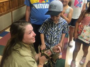 Mason Robinson, Seasonal Interpretive Park Ranger at Edgar Evins State Park brought in a live snake for the children to see last Thursday on final day of Library Summer Reading Program at the County Complex