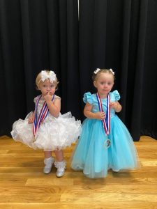 Miss Jamboree Pageant girls 13-24 months: Queen Olivia Denise Kilgore (left), 19 month old daughter of Ryan and Jasmine Kilgore of McMinnville. She also won for Miss Photogenic and Prettiest Hair and Attire. 1st runner-up and Prettiest Eyes: Amaya Bradley (right), 18 month old daughter of Amanda Bane and Jesse Bradley of Smithville.