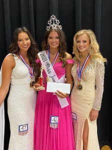 Addison Jean Puckett (center) was crowned Miss Jamboree Queen in the age 17-20 category Saturday at the county complex auditorium. Puckett, the 17 year old daughter of Jimmy and Anita Puckett of Smithville, was also awarded for Prettiest Eyes and Attire. The 1st runner-up was Monica Mashay Carlton (right) of Smithville, 18 year old daughter of Leroy and Amanda Hale and Travis and Sheena Carlton. Monica was also awarded for Most Photogenic. Leah Brooke Davis (left) was 2nd runner-up. She is the daughter of Kerry and Glenda Davis of Smithville. She was also awarded for Prettiest Hair and the People's Choice Award.