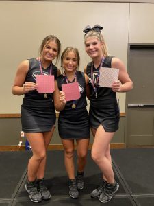 Cheerleaders offered applications to join NCA Staff Addison Puckett, Addison Roller and Keirstine Robinson