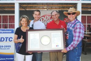 State Senator Mark Pody and State Representatives Terri Lynn Weaver and Clark Boyd presented Jamboree President and Coordinator Sam Stout a framed copy of a joint resolution adopted by the Tennessee State Senate and House of Representatives paying tribute to the Fiddlers’ Jamboree.