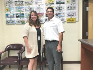 Katie Julian, county clerk liaison with the Tennessee Department of Revenue, recently stopped by to greet County Clerk James L. (Jimmy) Poss and the staff