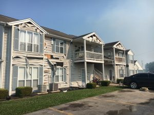 Heat from fire so intense at Towne’s Edge Apartments Sunday it melts siding on exterior of homes on the other side of the parking lot in the same complex