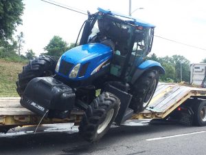 Tractor and bush hog after hitting underside of College Street Bridge