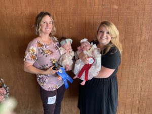 DeKalb Fair Baby Show: Girls (1 day to 3 months) Winner: Charlotte Moore, (left) 2 month old daughter of Jacob and Megan Moore of Smithville. Runner-up: Wylie Kate Garrett, (right) 4 week old daughter of Ryan and Erica Garrett of Alexandria