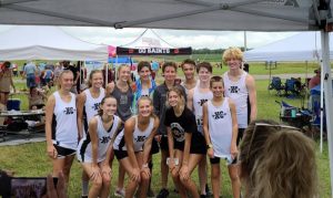 Members of the DCXC team. First row (left to right): Madeline Martin, Cadee Griffith, Ella VanVranken (injured), Cale Brown. Back row: Emily Young, Mylie Phillips, Chloe VanVranken, Caleb Gray,Ian Colwell, Andrew Tramel, and Kaleb Spears.