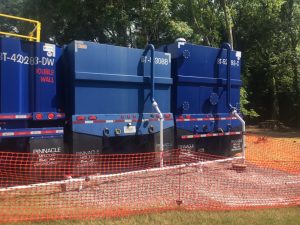 FRAC storage tanks set up at staging area behind Alexandria Senior Citizens Center where unknown substance is being pumped from a sump well near Hickman Creek