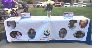 A Blessing Banner with photos of survivors and people in the community lost due to an overdose was on display during last year's Glowstick Vigil downtown Smithville