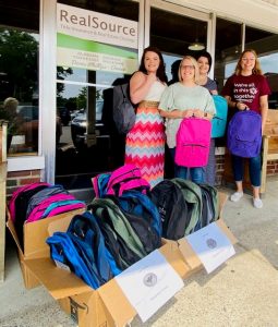 Circle of Love Foundation's Back to School Campaign Donates Backpacks with School Supplies. Pictured left to right: Loni Easterwood, RealSource Closing Specialist; Chelsie Bryant, Northside Elementary; Kendra Arnold, RealSource Support Specialist; Shawnie Davis, Smithville Elementary; Katie Harris, Office Manager (not pictured)