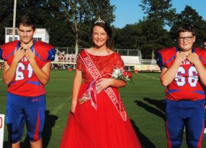 7th grade DeKalb West School attendant Kenadee Rose Prichard. Her escorts were Jaxon Kleparek (left) and Bradley Hale (right).