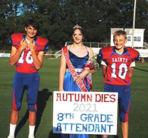 8th grade DeKalb West School attendant Autumn Grace Dies. Her escorts were Jon Hendrix (left) and Connor Hopkins (right)