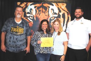 DeKalb County High School has begun a monthly observance to recognize a teacher, student, and parent or guardian of the month and the first recipients were honored Friday morning. Pictured left to right: DCHS Principal Bruce Curtis, Teacher of the Month Sonja House, and Assistant Principals Jenny Norris and Thomas Cagle