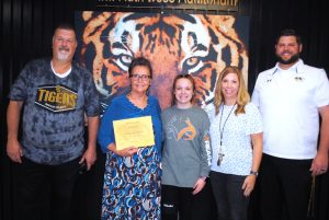 DeKalb County High School has begun a monthly observance to recognize a teacher, student, and parent or guardian of the month and the first recipients were honored Friday morning. Pictured left to right: DCHS Principal Bruce Curtis, Guardian of the Month Joann Meece with her granddaughter Arianna Barnwell, and Assistant Principals Jenny Norris and Thomas Cagle