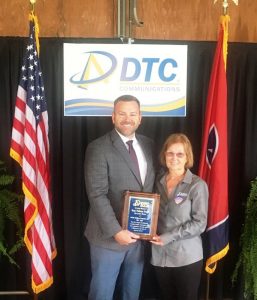 During the annual meeting of DTC Communications in September, CEO Chris Townson, on behalf of the Board of Directors, paid tribute Roy Nelson Pugh, a long time member of the Board from the Auburntown Exchange, who passed away last December. Townson presented a plaque in Mr. Pugh's memory to his wife Kathy who succeeded Pugh as a member of the DTC Board