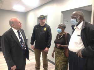 Smithville Police Chief Mark Collins welcomes Dr. Robert R. Atnip (left) and Jackie and Wade Smith during Open House of the new Smithville Police Department Building