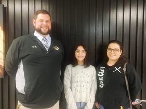 DCHS Assistant Principal Thomas Cagle presents certificate to Viridiana Valencia (right), mother of 9th grader Dana Gonzales (center) for being named Parent of the Month for November. Dana’s father Juan Arvizu (not pictured) shares the honor with Valencia. They were chosen as parents of the month based on an essay written by Dana in tribute to them