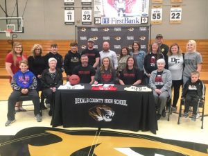 DCHS Lady Tiger Kadee Ferrell, a senior and member of the 1,000 point club, signed a letter of intent Tuesday with Bryan College in Dayton, Tennessee to play for the Lady Lions next season. Joining her at the signing pictured here seated left to right are: Tucker Webb, Diane Ferrell, Anthony Ferrell, Kadee Ferrell, Trena Ferrell, Betty Webb, and Rusty Chapman. Back Row standing left to right: Jaley Hale, Tara Hale, Maddox Hale, Ty Webb, Kalab Ferrell, Tad Webb, Tracy Webb, Danielle Collins, Tracie Baker, Mark Collins, Rayanna Chapman, and Dare Collins