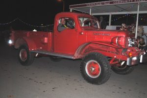 For best vintage automobiles at the Alexandria Christmas Parade, Mike Stallard and Justin Paschal tied for 1st place. Stallard had a 1957 Dodge Power Wagon Pickup shown here
