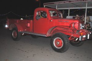 For best vintage automobiles at the Alexandria Christmas Parade, Mike Stallard and Justin Paschal tied for 1st place. Stallard had a 1957 Dodge Power Wagon Pickup shown here