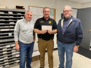 Pictured are Brian Clark (left) and Pete Siggelko (right) of the Mountain Harbour Property Owners Association with Sheriff Ray.