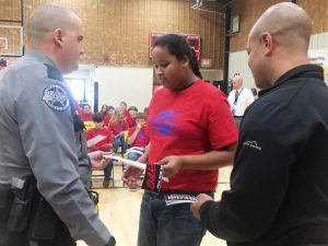 DeKalb West School Fifth grader Javan Hefflin receives D.A.R.E. graduation certificate from SRO and D.A.R.E. Fifth Grade Instructor Billy Tiner of the DeKalb County Sheriff’s Department (left) and Chief Deputy Robert Patrick (right) at the DWS D.A.R.E graduation Wednesday.