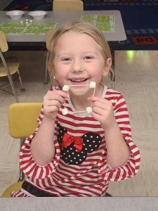 Paisley Adams shows off the snowball shape she made