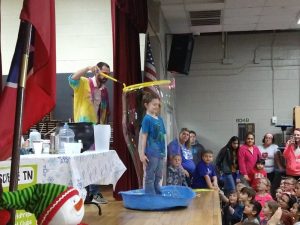 The Science Guy enclosing a student into a giant bubble