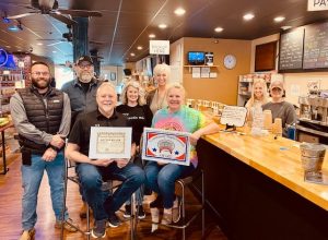Chamber Presents Community Improvement Award to Button Willow General Store and Coffee Shop. Pictured: Owners Joe and Angela Brown. Back: Smithville Mayor Josh Miller, Chamber Board Member Tony Luna, Downtown Business Owner Sommer Luna, and Chamber Director Suzanne Williams Behind Counter: Bella France and Courtney Odom