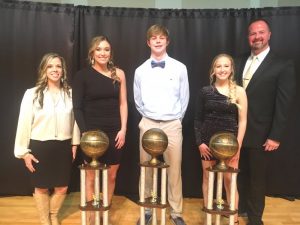 Sophomore Conner Close (center) was named the DCHS Tiger basketball Most Valuable Player at the annual team banquet, while Senior Kadee Ferrell (2nd from left) received the Lady Tiger MVP honor. Junior Amelia Atnip (2nd from right) is the Most Valuable Cheerleader. The awards were sponsored by Love-Cantrell Funeral Home and presented by Chad and Shelia Kirby (pictured far right and left). The MVP and MVC awards are named in memory of Kirby’s grandfather Allen D. Hooper.