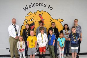 DWS April Students of the Month: Front row left to right are Lailynn Rice, Dawson Allcorn, Kaden Cameron, Aler Organ, Lavvy Carver, and Carl Shelton. Back row left to right are Assistant Principal Joey Agee, Akacia Walker, Connor Talley, Wyatt Young, Bella Gonzalez, and Principal Sabrina Farler.