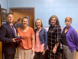 The 2022 DeKalb Middle School Teacher of the Year is Teresa Jones, a seventh-grade math teacher. Pictured left to right: Director of Schools Patrick Cripps, DMS Teacher of the Year Teresa Jones, DMS Principal Lacey Foutch, DMS Assistant Principal Anita Puckett, and Supervisor of Instruction Michelle Burklow