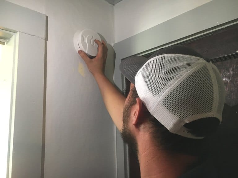 DeKalb Firefighter Blake Reffue installs smoke alarm at the home of Clay and Sharon Farler in Smithville Saturday as part of a “Smoke Alarm Installation Blitz” across DeKalb County by the DCFD and American Red Cross